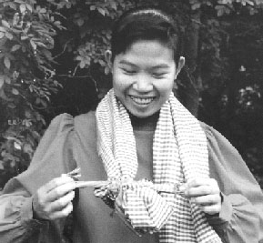 Photo of Sokha tying her kan saeng