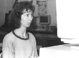 Photo of Marta typing her story into a computer